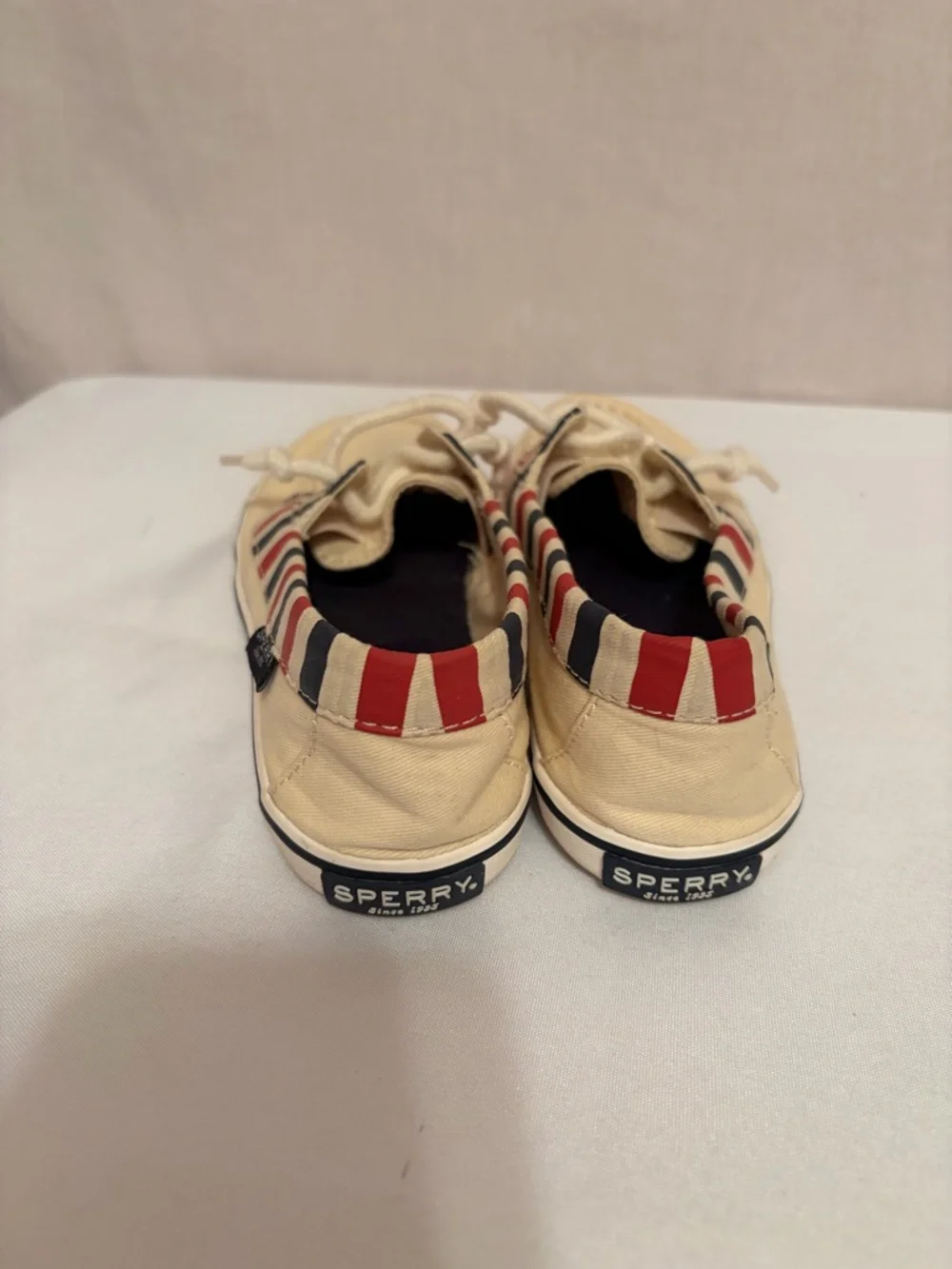 Sperry Lounge Away sneakers in a natural, red, and blue stripes